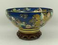 A Spode porcelain fruit bowl decorated with leaves against a cobalt blue ground, 26 by 13cm high.
