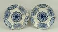 A pair of Continental tin glazed earthenware plates, late 18th century, decorated in blue and white ... 