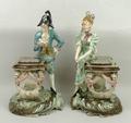 A pair of Continental pottery figures, late 19th century, modelled as a man and woman in early  nine... 