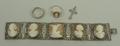 A silver and cameo Art Nouveau bracelet of five cameos set in floral and foliate squares, four depic... 