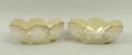 A pair of Belleek porcelain salts, first black mark, moulded with shells and seaweed, 8 by 5 by 3.5c... 