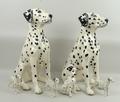 A pair of Beswick ceramic seated fireside Dalmations, 36cm high, two gloss and one matt standing Dal... 