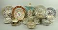 A group of porcelain including a set of six hand painted floral porcelain plates, six various cups a... 