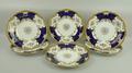 A set of six Coalport porcelain plates, late 19th century, decorated with flowers against a cobalt b... 