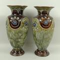 A pair of Royal Doulton stoneware vases, early 20th century, of baluster form with tube lined and je... 