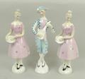 A group of Royal Doulton figures, comprising; 'Harlequin' HN2186, and two of 'Columbine' HN2185. (3)