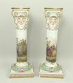 A pair of Meissen porcelain candlesticks, late 19th century, of columnar form with Ionic capitals ov... 