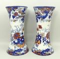 A pair of pottery vases, late 19th century, of waisted form transfer decorated in blue and white and... 