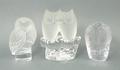 A group of three glass owl paperweights, comprising a Lalique owl, etched Lalique, France, 9cm, a pa... 