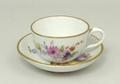 A Meissen porcelain miniature tea cup and saucer, early 20th century, painted with floral sprays, bl... 