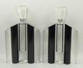 A pair of Art Deco style clear and black glass five section scent bottles, the stoppers with scent r... 