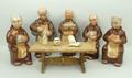 A set of five Cortendorf pottery decanters modelled as monks, printed marks, together with an oak mo... 