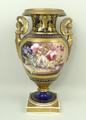 A Derby porcelain vase, early 19th century, of twin caryatid handled baluster form, reserve painted ... 