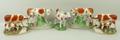 A pair of Staffordshire pottery figures, late 19th century, modelled as a cow and milk maid, further... 