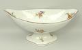 A porcelain fruit bowl, possibly Coalport, early 19th century, of boat shaped pedestal form moulded ... 