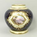 A Coalport porcelain vase, early 20th century, of globular form reserve painted with a lake and moun... 