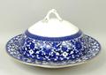 A Coalport pottery part dinner and coffee service decorated in blue and white with chinoiserie flowe... 