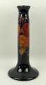 A Moorcroft pottery candle table lamp base of cylindrical form, on an outswept base, decorated in th... 