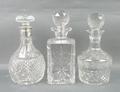A group of cut glass decanters, comprising; an Edinburgh decanter etched with grapes and vines, 25cm... 