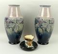 A pair of Royal Doulton stoneware vases of shouldered, ovoid form decorated with Clematis against a ... 