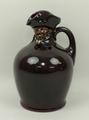 A Royal Doulton pottery series ware whisky Jug modelled as the Night Watchman, 21cm high.