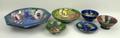 A quantity of Moorcroft pottery, comprising; an octagonal bowl decorated in the 'Poppy' pattern, 25.... 