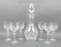 A Harrods set of six crystal glasses and a decanter, 33cm, in original Harrods box.