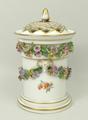 A Meissen porcelain pot pourri pot, inner lid and pierced cover, late 19th century, encrusted with f... 