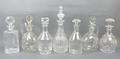 A group of cut glass decanters, 20th century, including one by Baccarat, France, and a near pair of ... 
