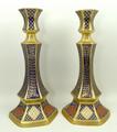 A pair of Caverswall porcelain candlesticks of hexagonal baluster form imari decorated in the 'Roman... 