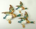 A group of three Beswick pottery graduated flying ducks, 596/2, 596/3 and 596-4, 23 by 22cm to 15 by... 