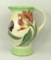 A Royal Doulton pottery water jug of baluster form painted with Tulips, D5416, 19cm high.