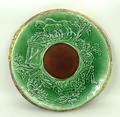 An Adams & Bromley majolica bread board, late 19th century,  moulded to the top with a hunting scene... 