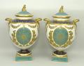 A pair of Wedgwood porcelain vases and covers, late 19th century, of twin handled baluster form, the... 