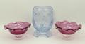 A pair of Victorian cranberry glass pedestal sweetmeat dishes, 7 by 12cm, and an Art Deco pressed tu... 