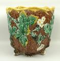 A Fielding majolica jardiniere, late 19th century, moulded with blackberries and oak leaves against ... 
