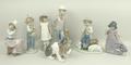 A Lladro porcelain figure of a puppy and six Nao figures comprising a shepherd, girl with parasol, s... 