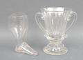A George III glass stirrup cup of plain form, 10cm, and a twin handled Georgian glass syllabub glass... 