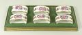 A set of six Royal Crown Derby porcelain napkin rings decorated in the 'Derby Posies' pattern, boxed... 