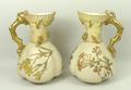 A pair of Royal Worcester blush ivory jugs, shape 1507, decorated with sprigs of spring flowers, the... 