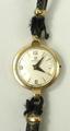 An Omega lady's 9ct gold wristwatch, circular dial bearing Arabic numerals, serial number 17541785, ... 