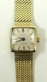 An 18ct gold Buren J.M.S lady's wristwatch, square silvered dial with baton numerals, on an 18ct gol... 