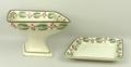 A creamware comport and stand, possibly Leeds, early 19th century, of lozenge form painted with a ba... 