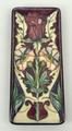 A Moorcroft pottery dish of rectangular form, circa 2000, decorated with a stylised rose pattern, im... 