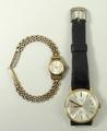 A lady's 9ct gold cased Omega wristwatch, circular champagne dial, on a 9ct gold gate bracelet, toge... 