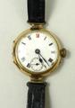 A 9ct gold cased wristwatch, 1920s, Roman numerals to dial with subsidiary seconds dial, on black le... 