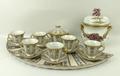 A Sevres style porcelain coffee set, blue floral pattern with gilt borders, comprising six coffee cu... 