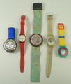 A group of 1960's Swatch watches with coloured straps. (5)