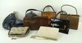A collection of handbags, comprising a petit point needlework 1920's clutch bag with soapstone clasp... 