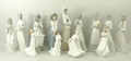 A quantity of porcelain figures comprising a Nao lady no. 565, a Nao figure no. 3 in original box, f... 